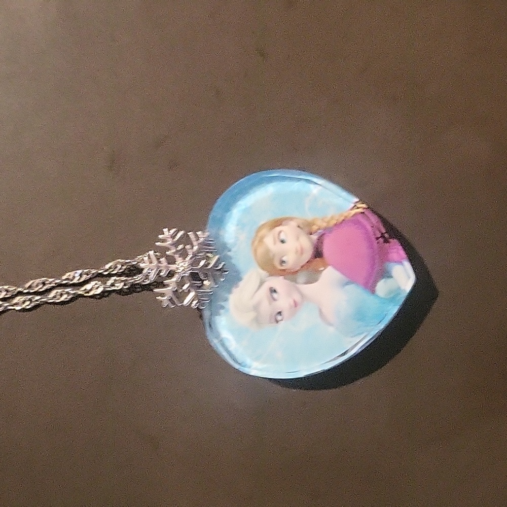 Frozen Necklace with "true love can thaw a frozen heart" written on back